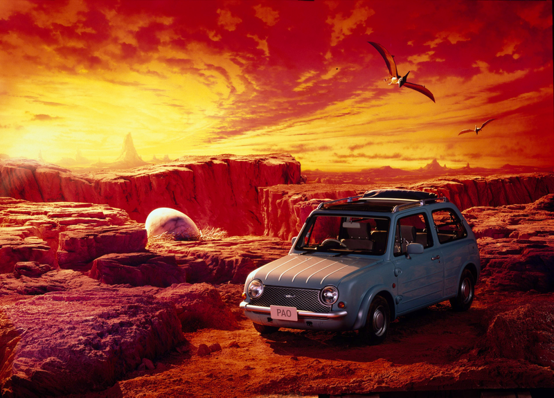 Illustration for article titled The Nissan Pao's Press Pics Have Dinosaurs, Are The Greatest Ever